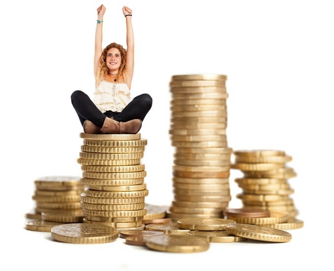 curly haired woman sitting pile coins